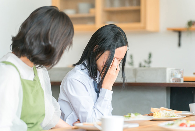 具合の悪い女性