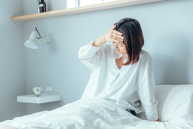 具合の悪い女性